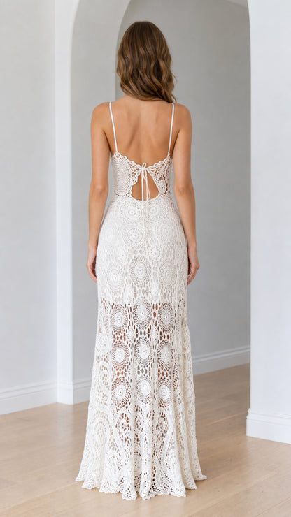 Back view of ivory crochet maxi dress showing low back cutout and tie detail