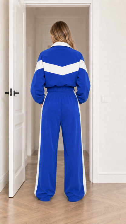 Back view of model wearing Royal Blue cropped jacket and wide-leg sweatpants set