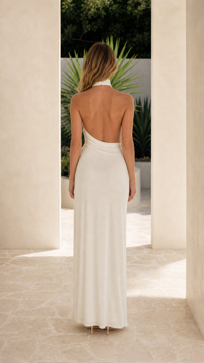 Back view showcasing the open back design of the white gown