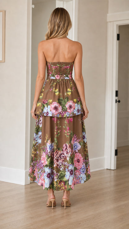 Back view of woman wearing brown floral strapless maxi dress