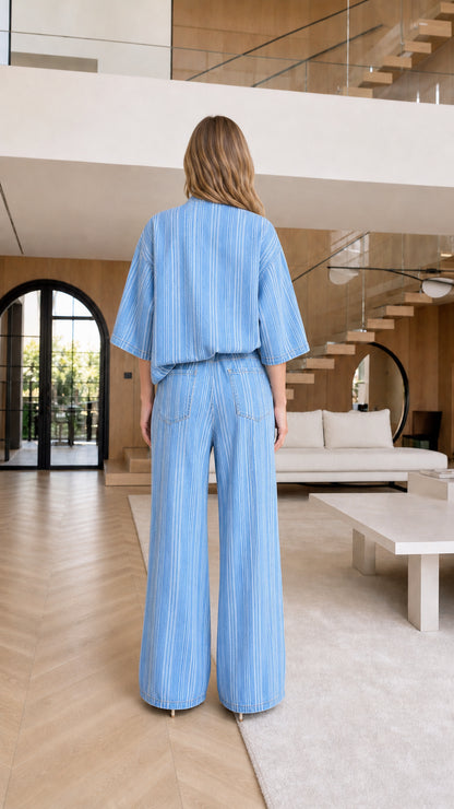 Model wearing light blue striped matching set, back view