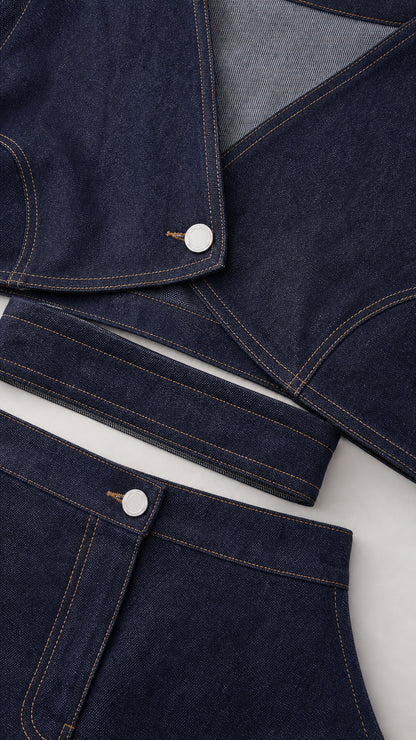 Close-up of indigo blue set showing button closure and topstitching