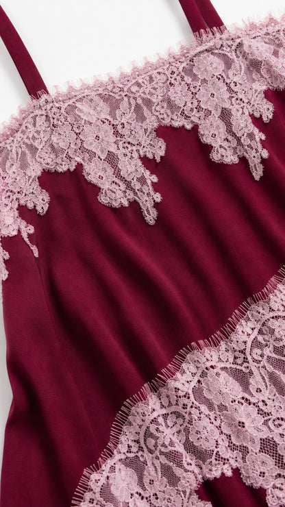 Close-up detail of lace trim on burgundy maxi dress