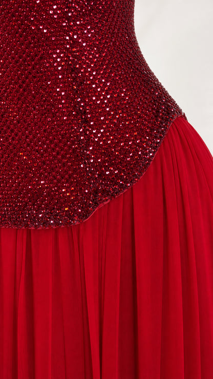 Close-up detail of red sequin bodice texture and pleating