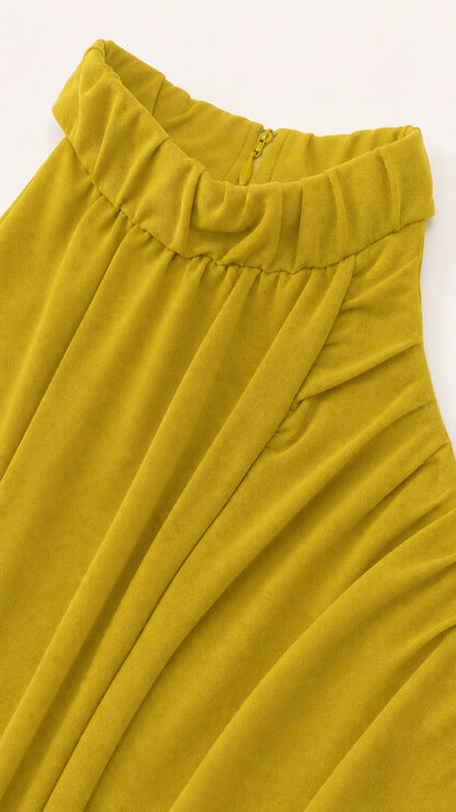 Close-up detail of gathered mock neckline and draped jersey fabric in chartreuse