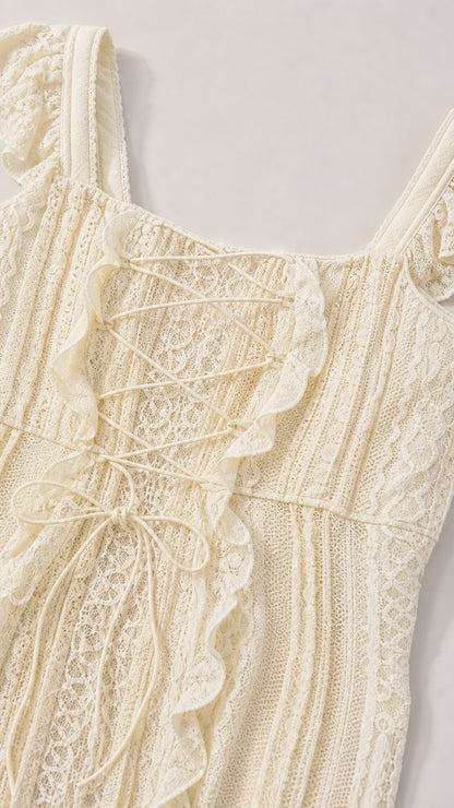 Close-up detail of lace-up corset front and ruffles