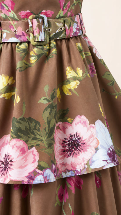 Close-up of the belted waist and floral fabric pattern
