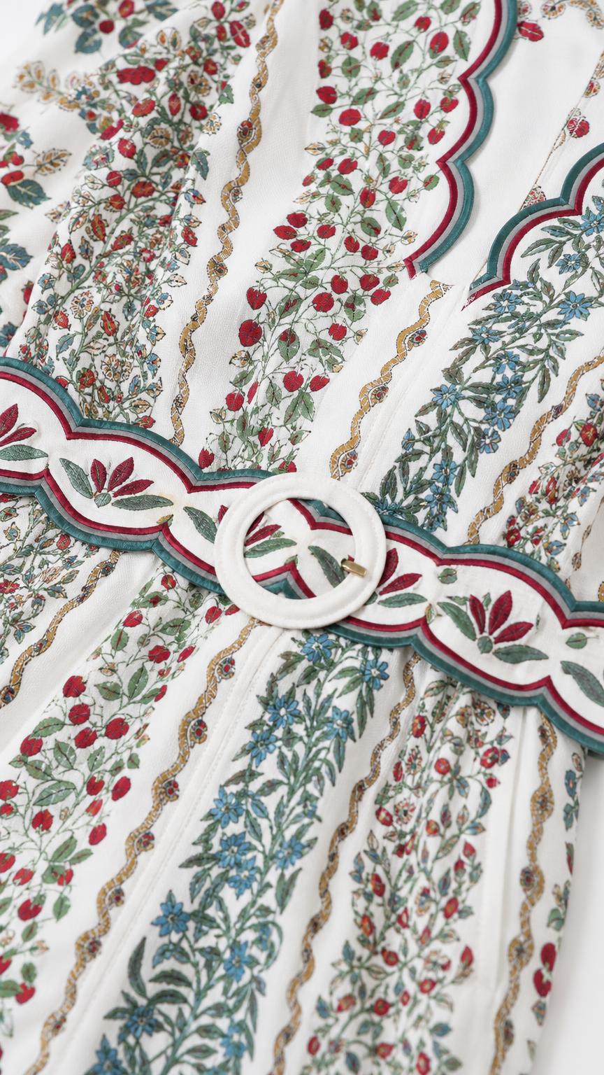 Close-up detail of fabric pattern and matching waist belt