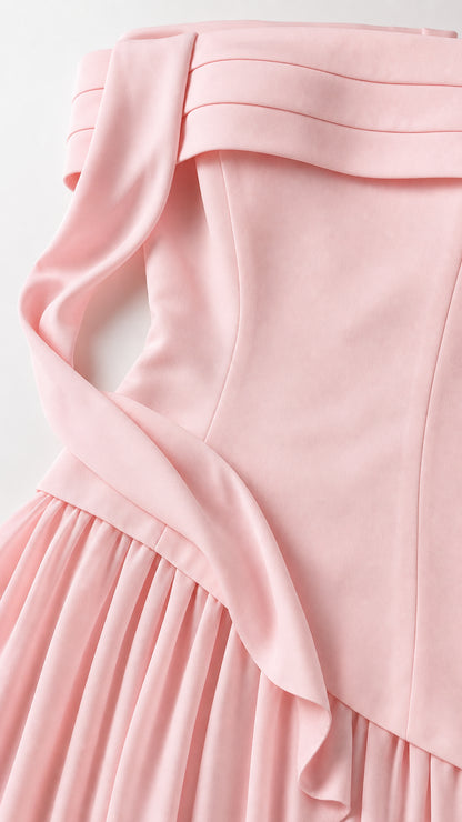 Close-up detail of folded neckline, strap, and bodice overlay in pink