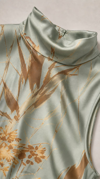 Close up of mock neck detail on sage green botanical dress