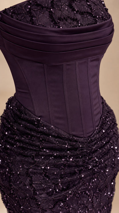 Close-up detail of the structured corset bodice and textured sequin skirt