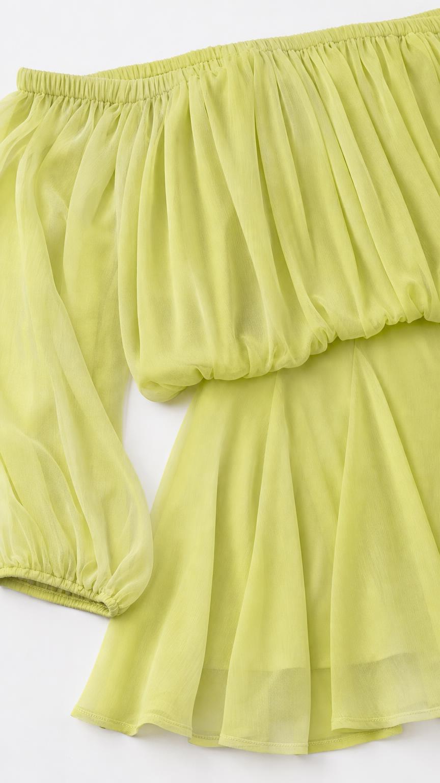 Close-up detail of chiffon fabric and sleeve on lime dress