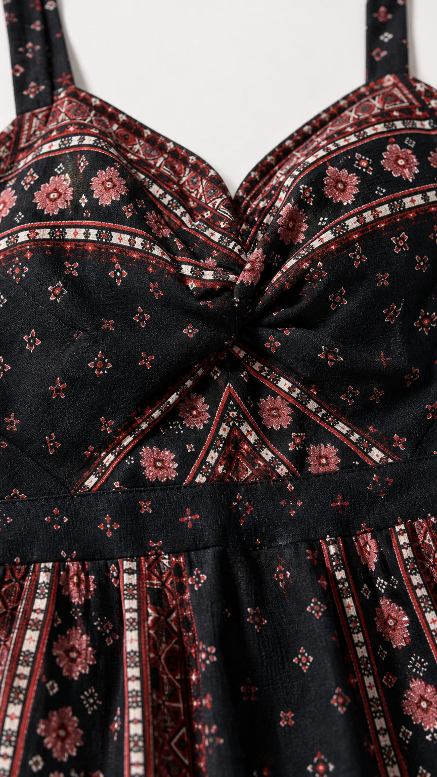 Close-up of the twist-front sweetheart neckline and print detail