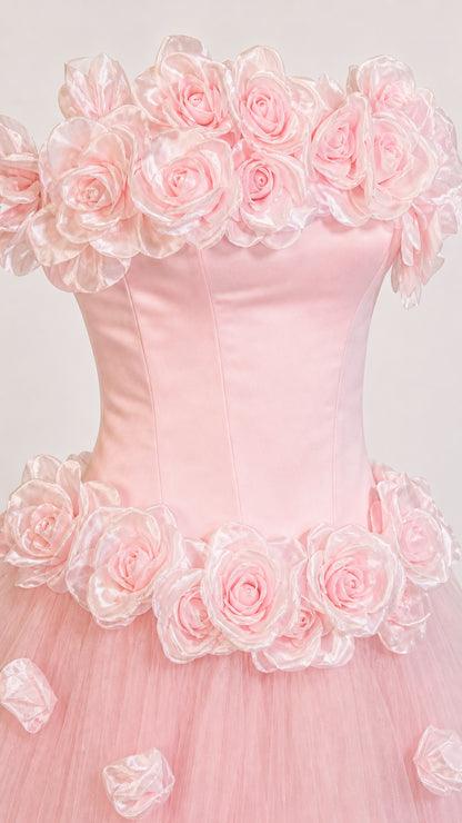 Close-up detail of the 3D rose appliqués on the bodice and waist