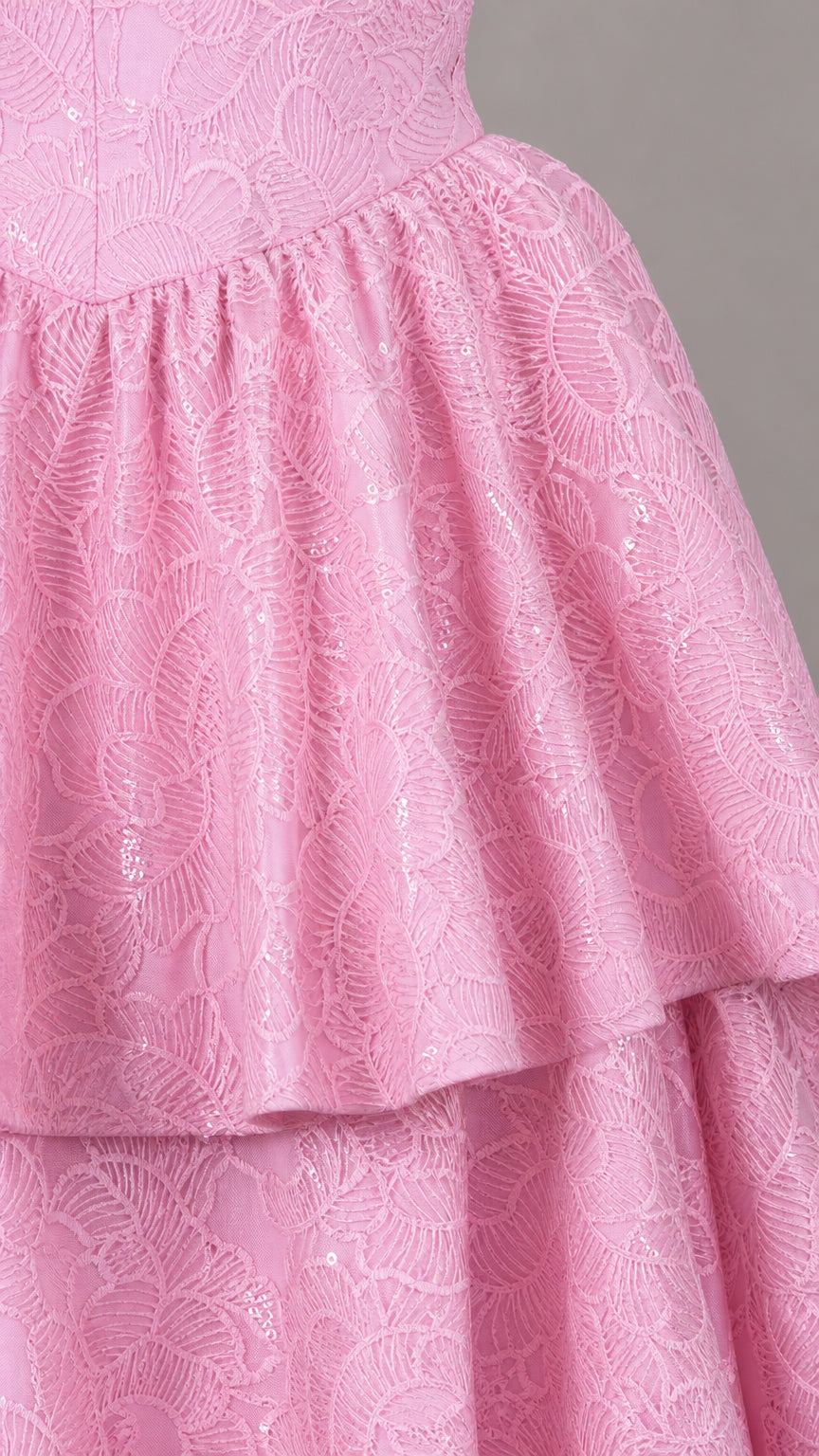 Close-up detail of textured lace fabric and tiered ruffles