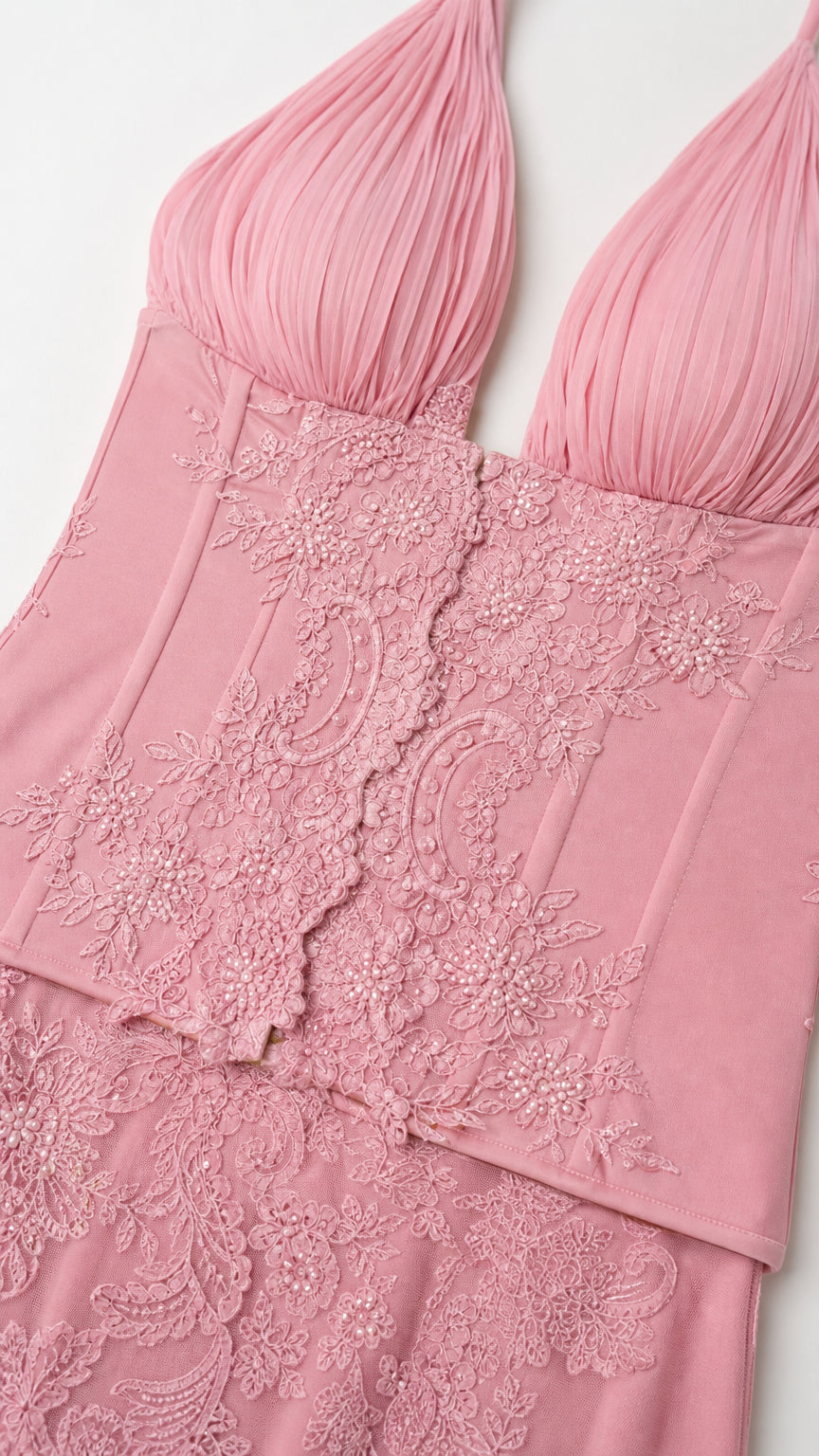 Close-up of pink bodice ruching and lace trim detail