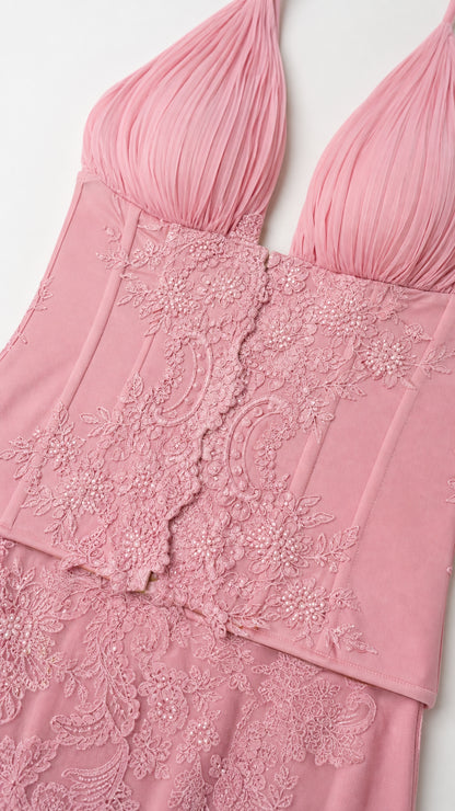 Close-up of pink bodice ruching and lace trim detail