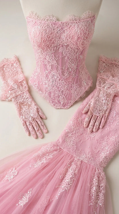 Close-up of pink lace bodice and matching gloves