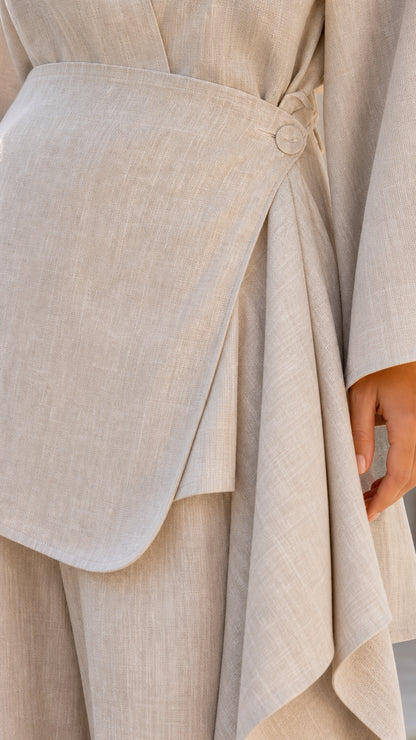 Close-up detail of side button wrap closure on tunic