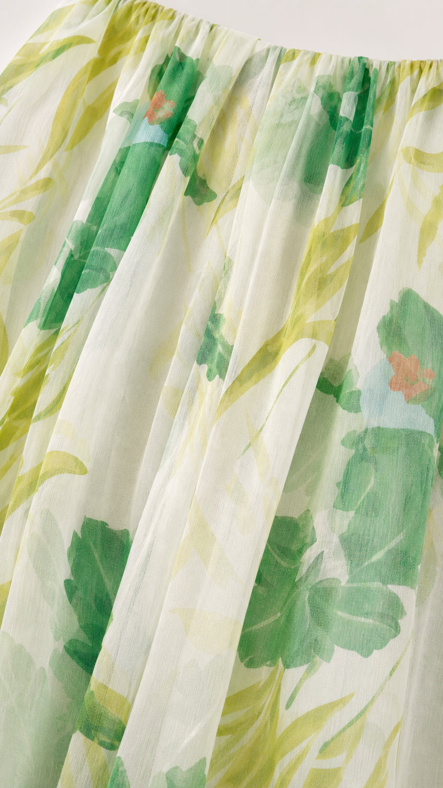 Close-up detail of the gathered neckline and fabric texture
