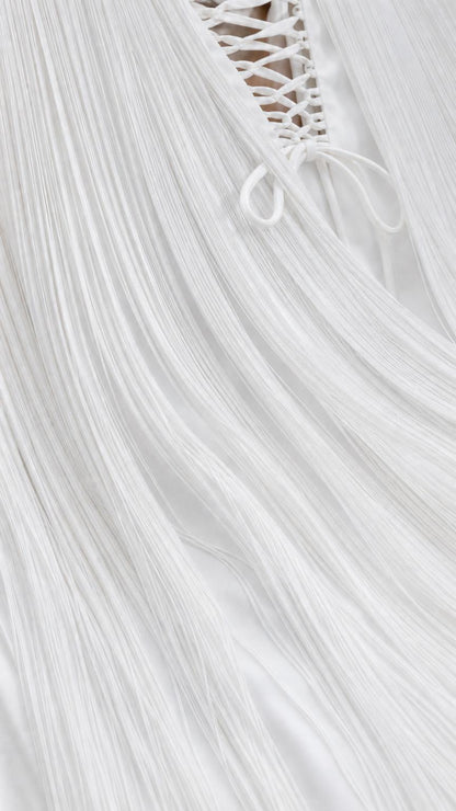 Close-up of fine vertical fringe texture and back lacing