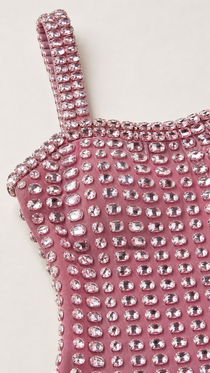 Close-up detail of rhinestone straps and neckline