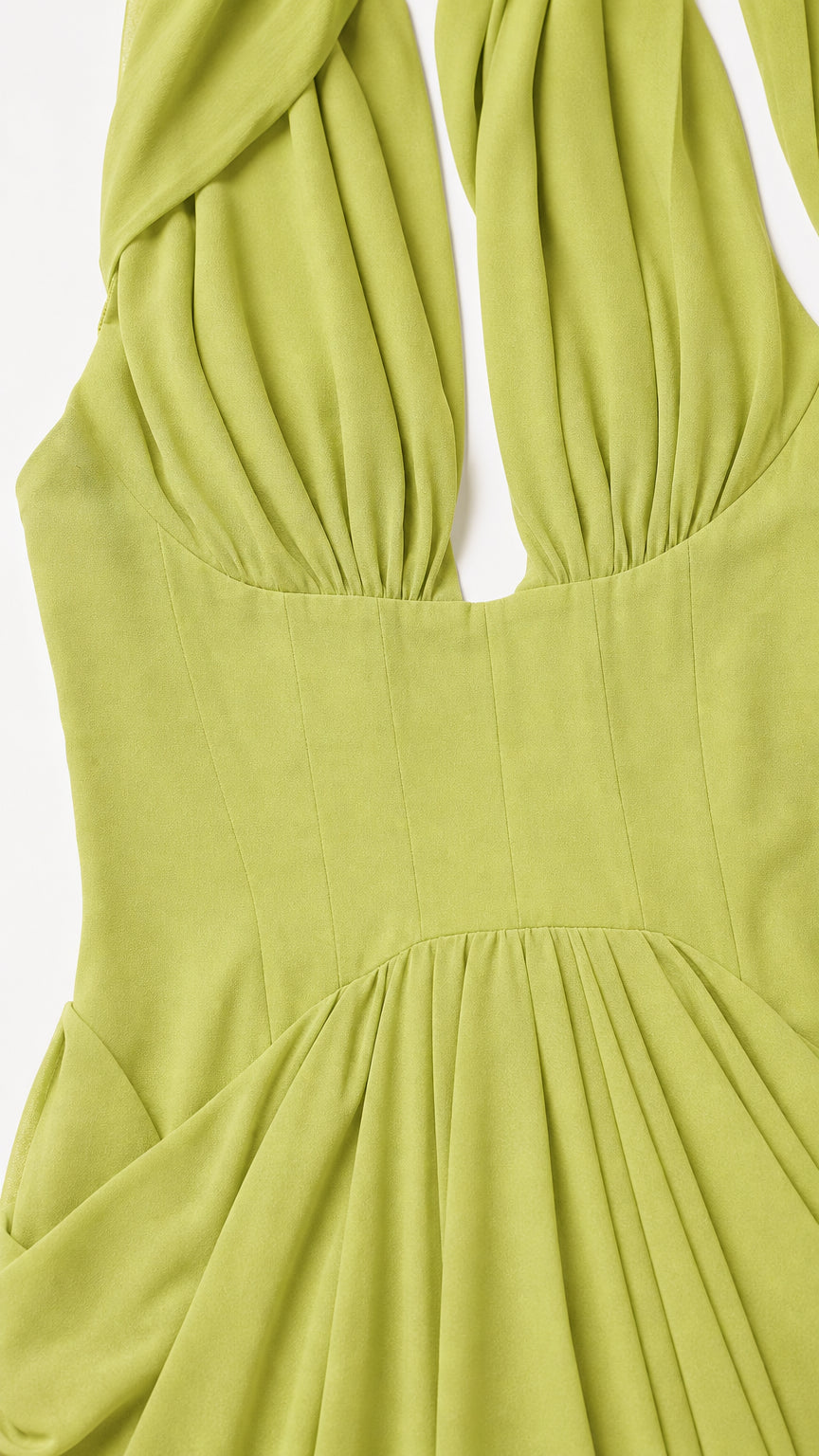 Close-up of pleated bodice on green evening dress