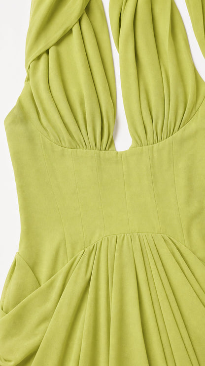 Close-up of pleated bodice on green evening dress