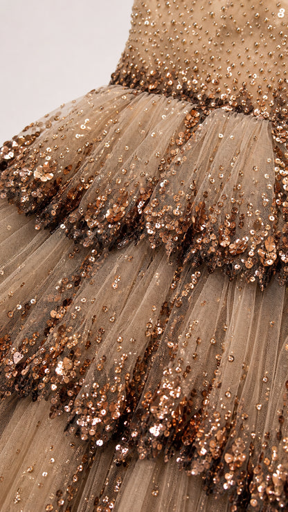Close-up detail of tulle ruffles and sequin embroidery
