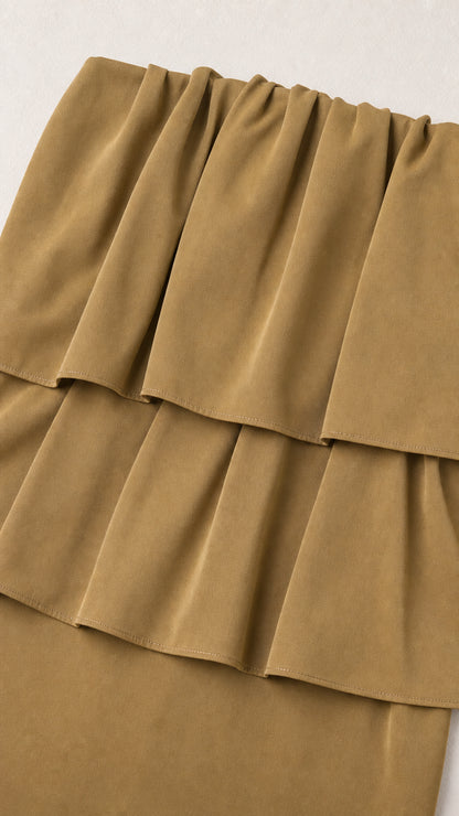 Close-up detail of the layered ruffles on the olive top