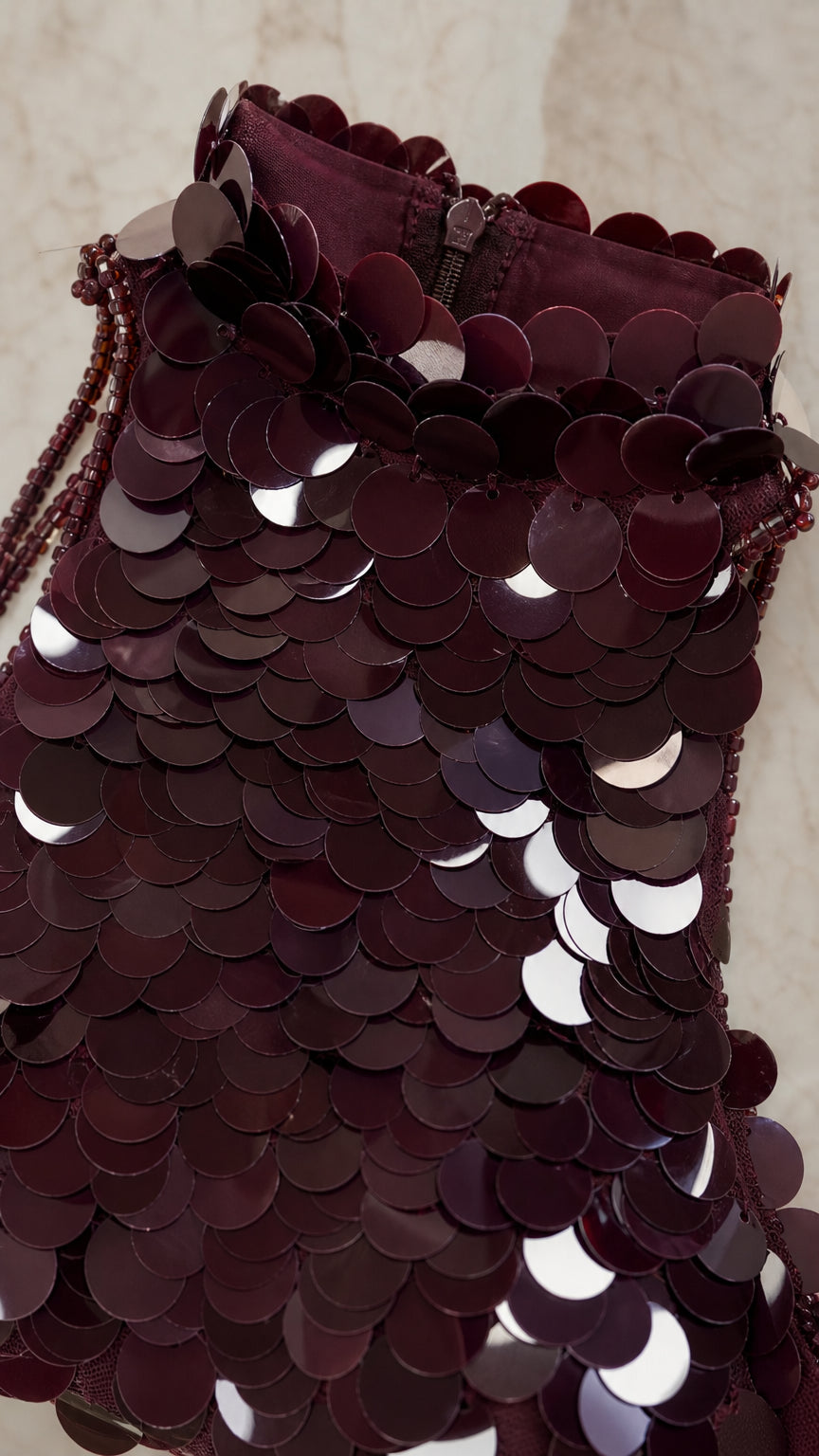 Close-up detail of Burgundy disc sequins and collar