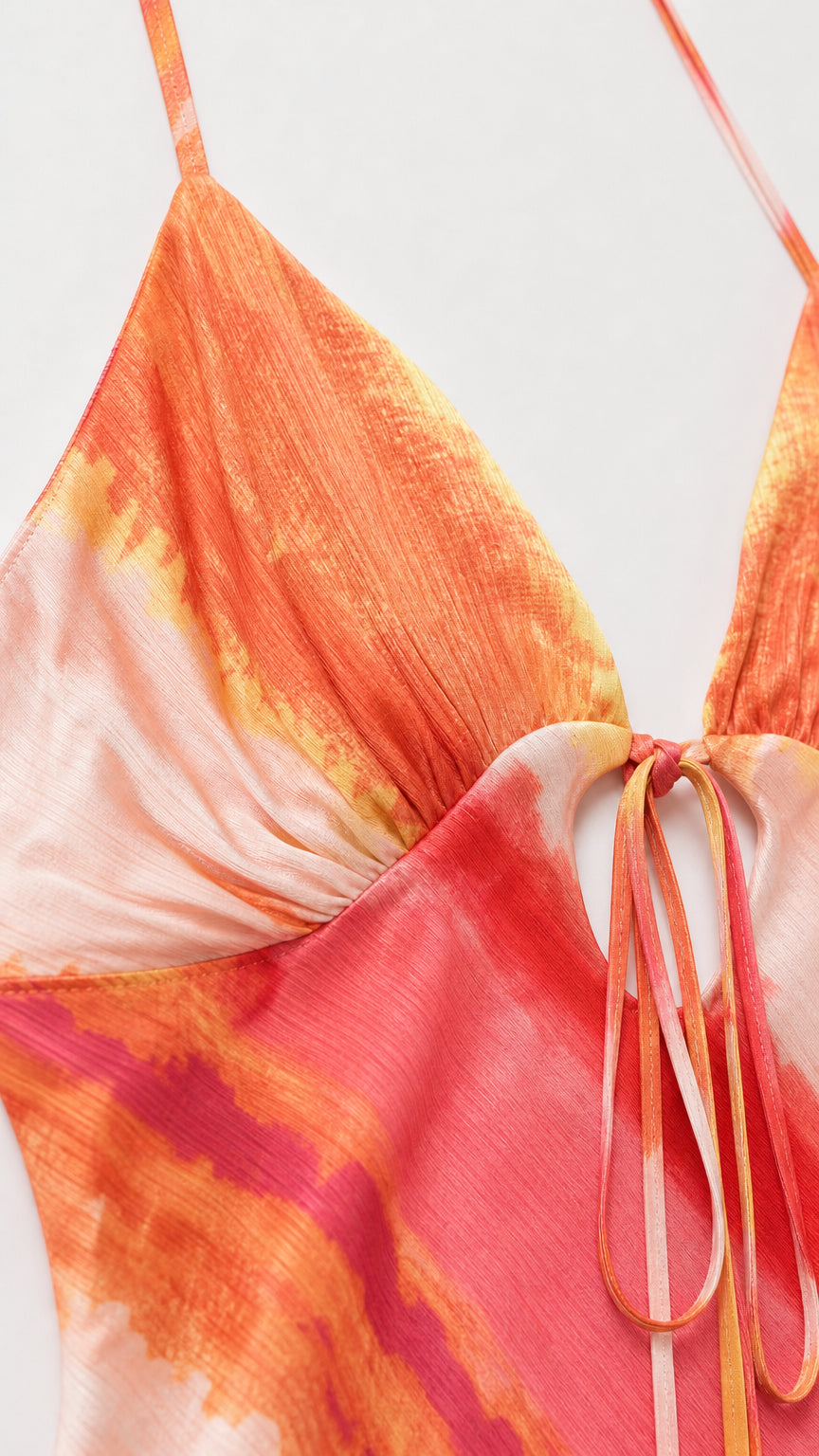 Close up of tie front detail and adjustable straps on maxi dress