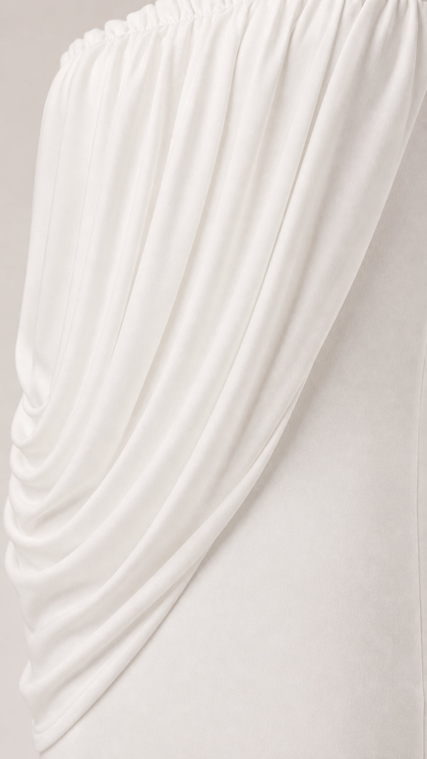 Close up of textured fabric on white draped dress