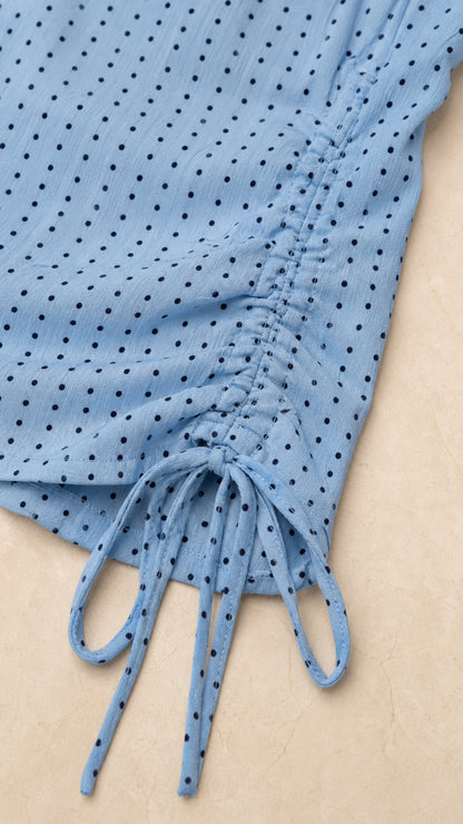 Close-up detail of side drawstring and dot fabric texture