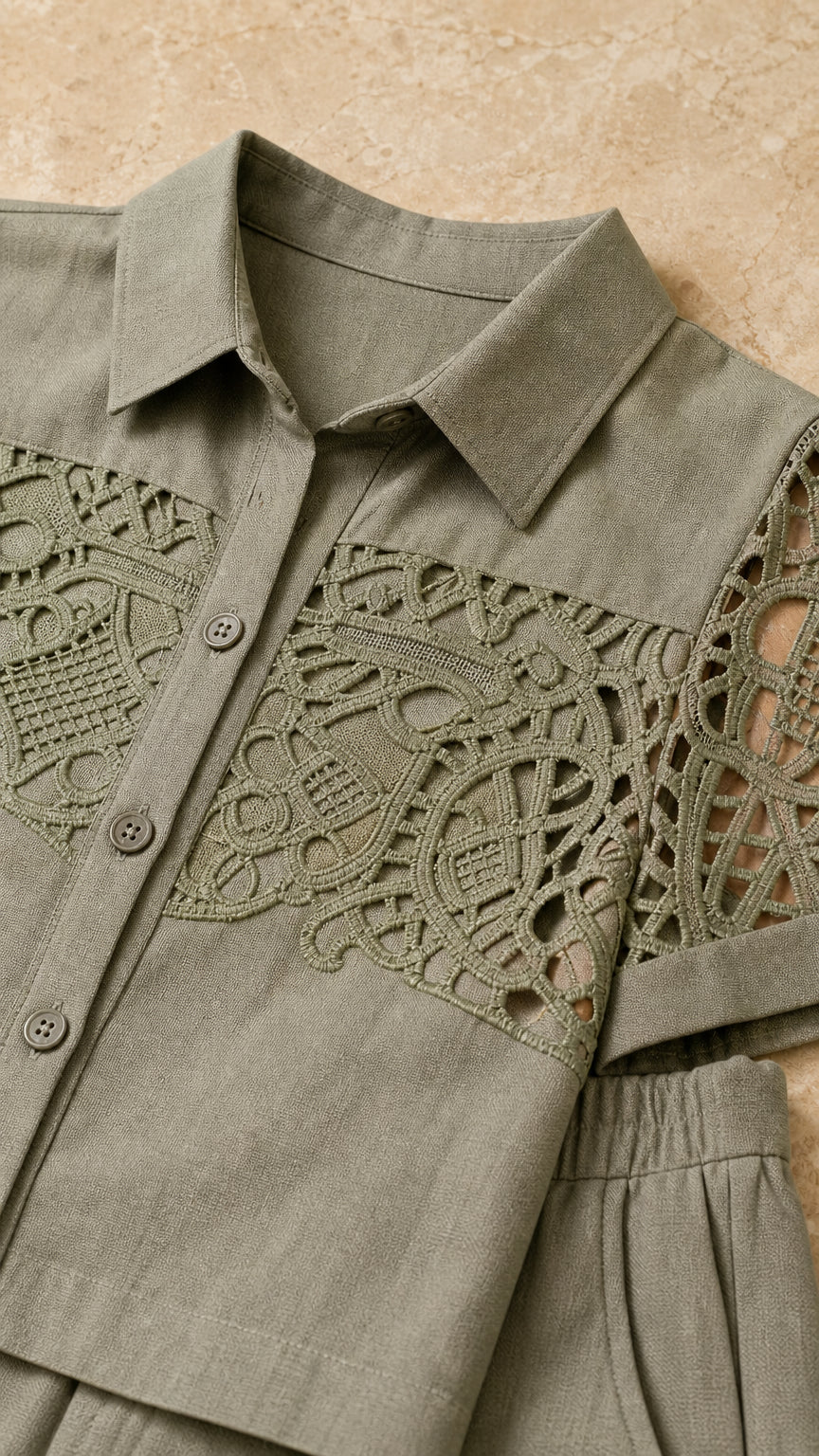 Close-up of the sage green collar, buttons, and lace-look top detailing