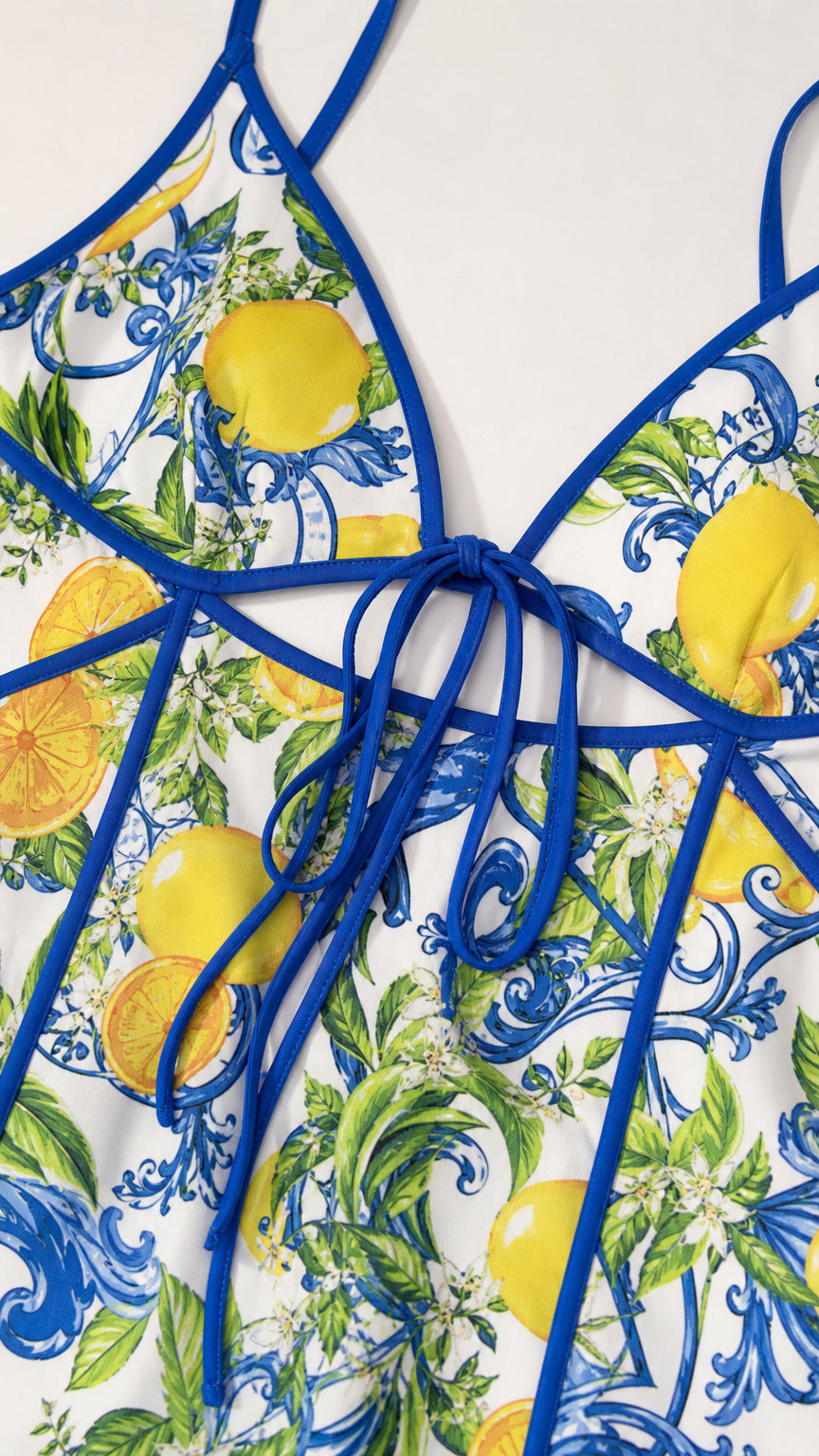 Close-up flat lay view of the lemon print fabric and contrast blue piping