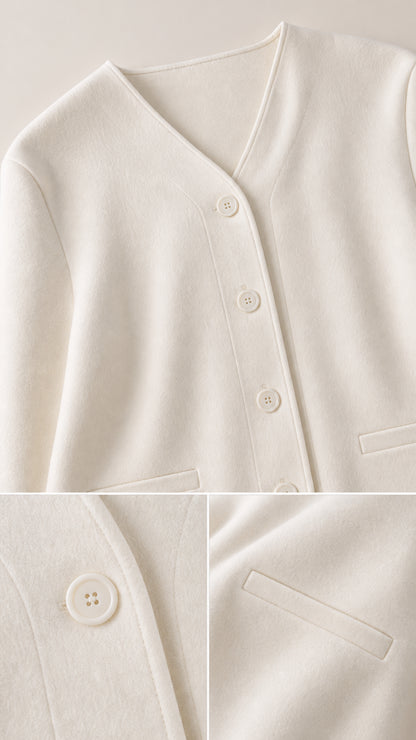 Close-up details of cream knit cardigan featuring V-neckline, tonal buttons, and welt pocket detail