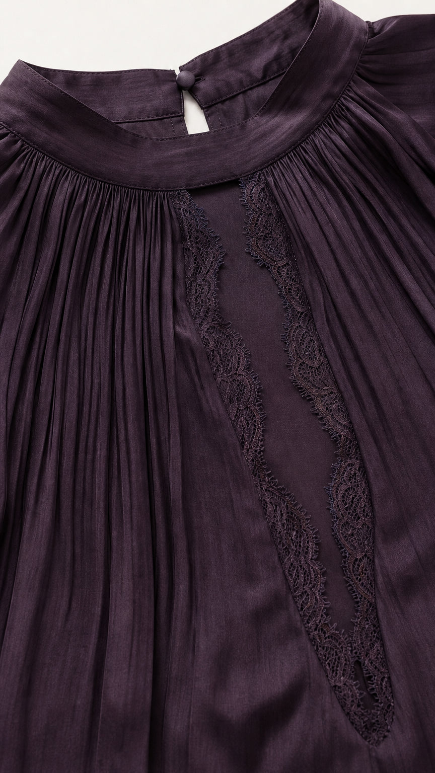 Close up of high neckline and lace trim on plum dress