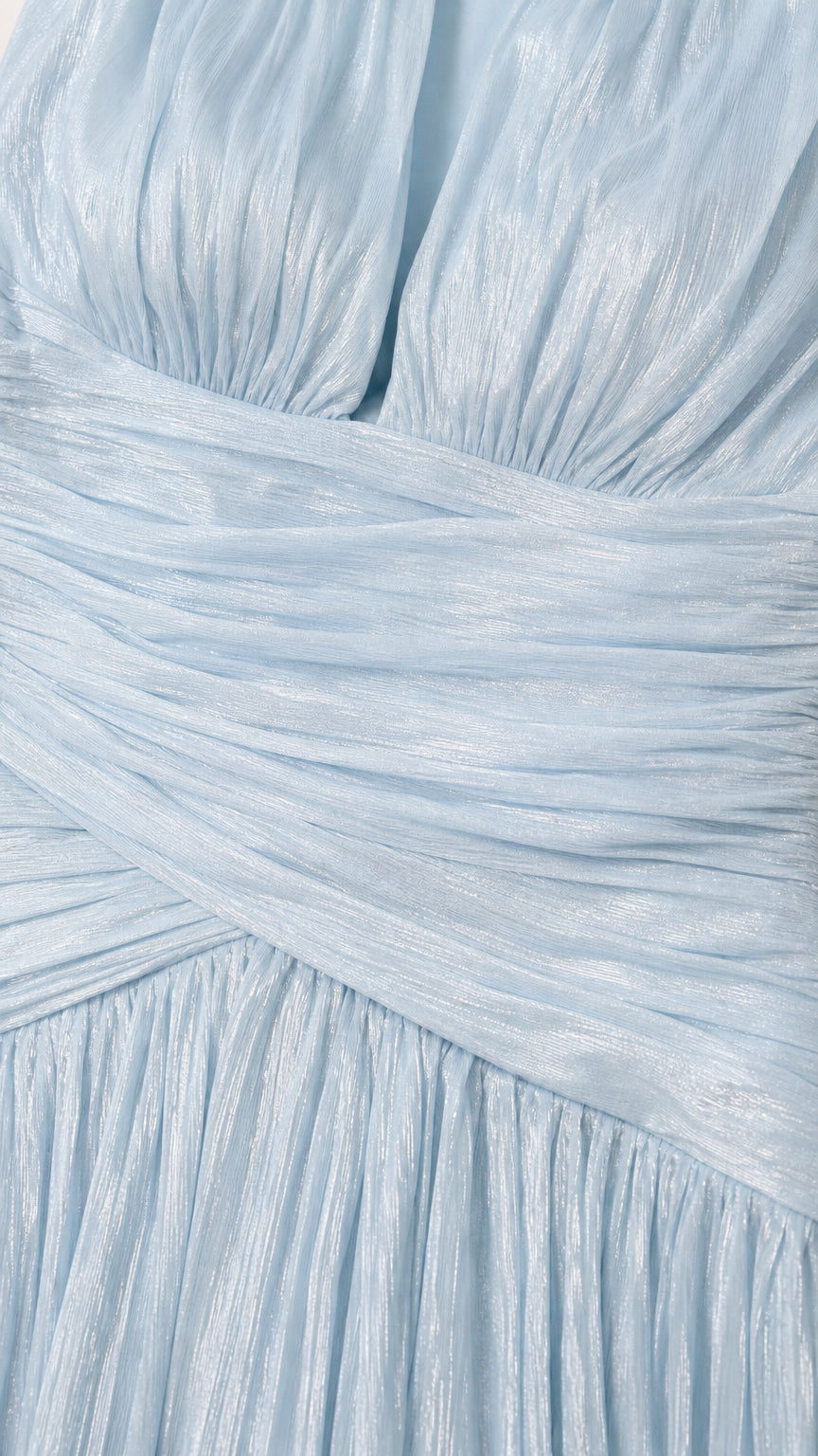 Close-up of fabric texture and pleated waist detail