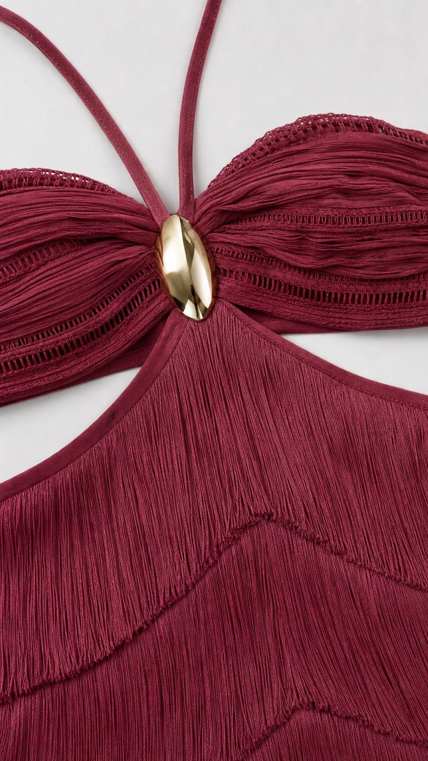 Close-up of halter top and hardware detail on burgundy dress