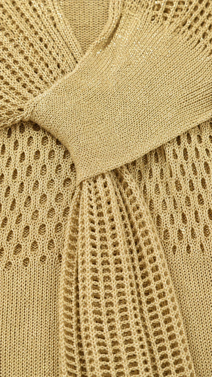 Close-up detail of the knit fabric and waist sash