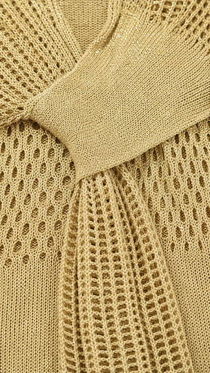 Close-up detail of the knit fabric and waist sash