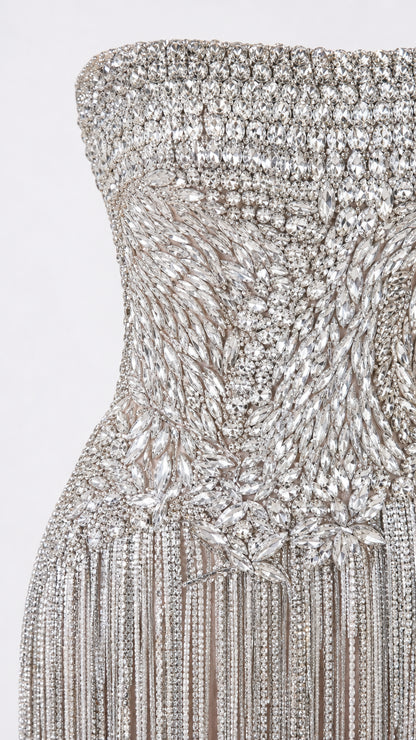 Close-up view of intricate crystal bodice embellishment and fringe transition