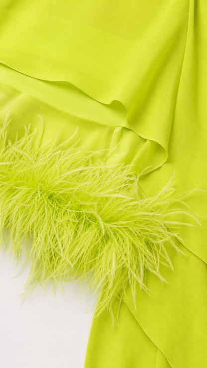 Close-up detail of lime green fabric and feather hem