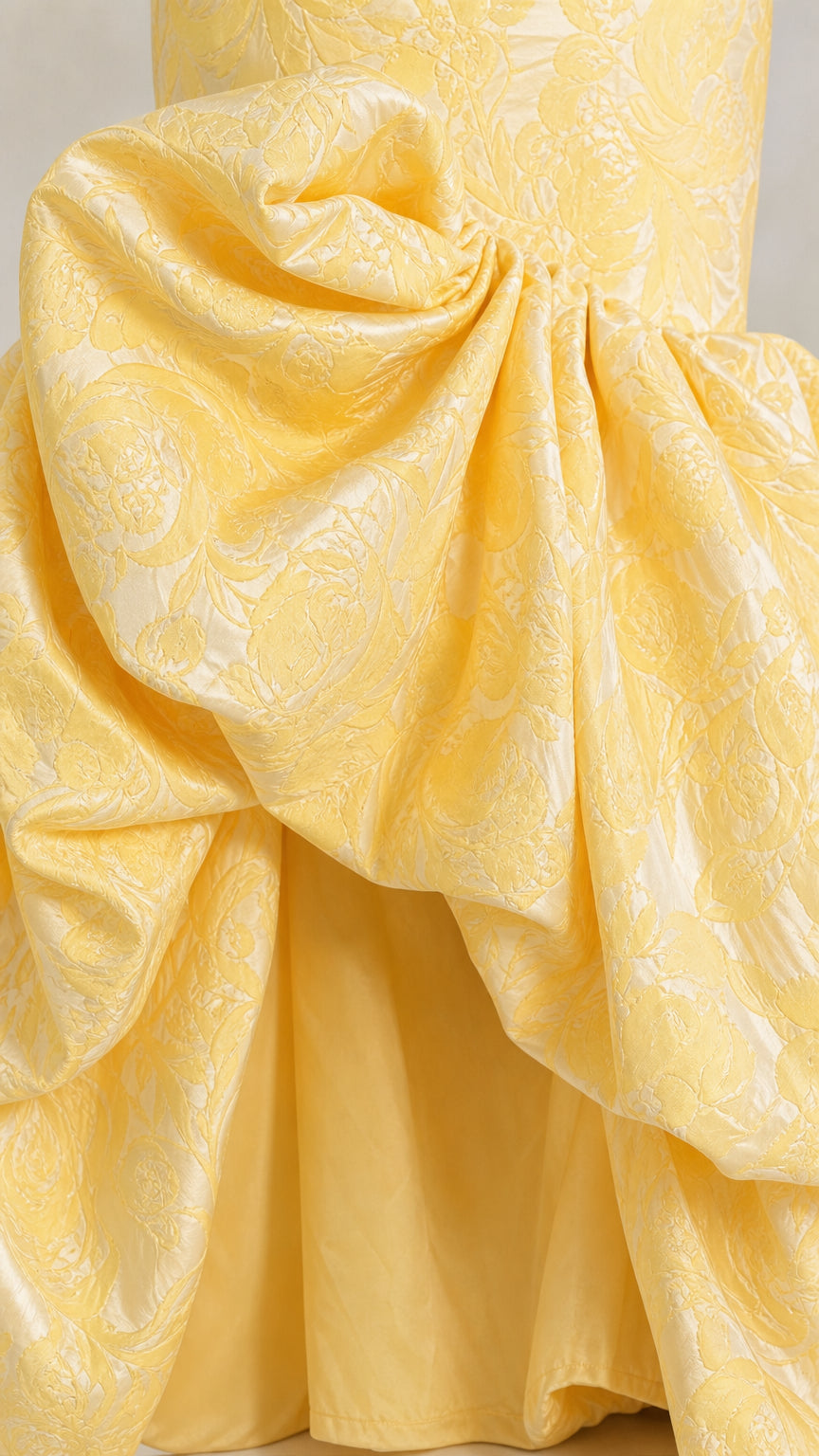 Close-up detail of gathered floral brocade bubble skirt hemline