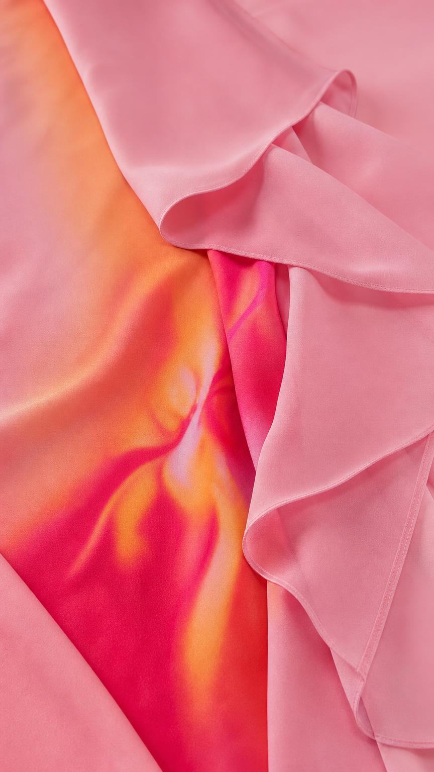 Close-up of smooth fabric texture and pink-orange ombre gradient