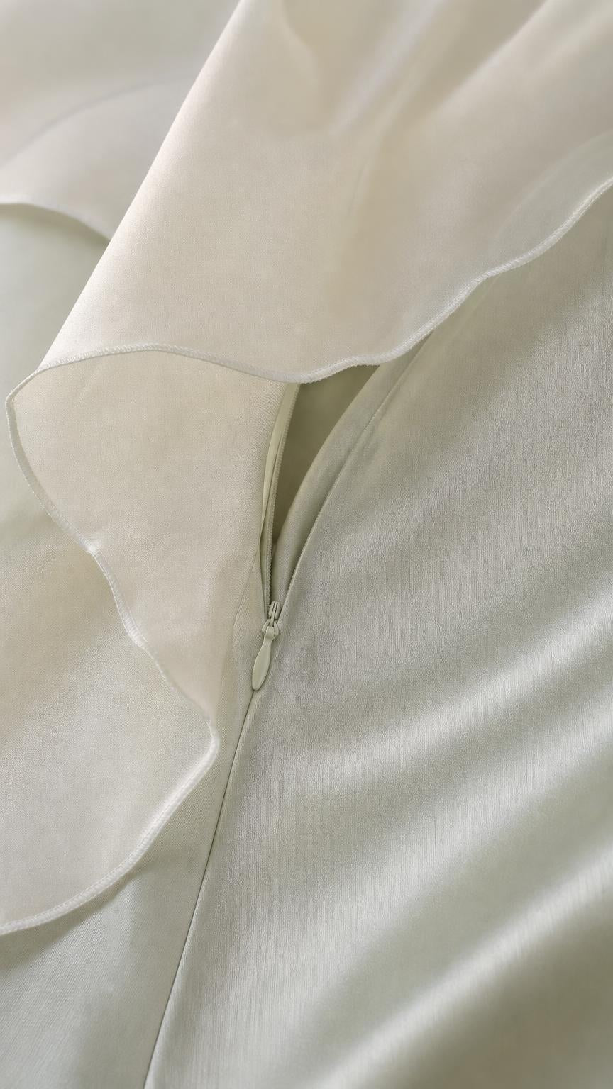 Close-up of concealed zipper and smooth satin fabric detail