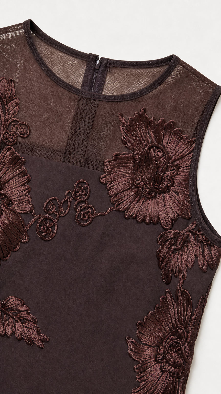 Close-up of bodice detail showing mesh and floral embroidery