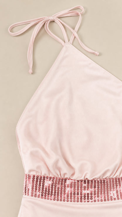 Close-up of halter neckline and sequin waistband
