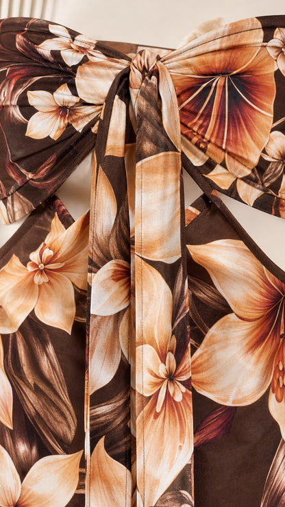 Close up of front bow detail on floral maxi dress